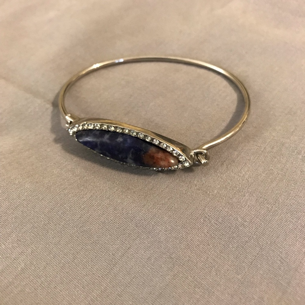Silver bracelet with blue stone